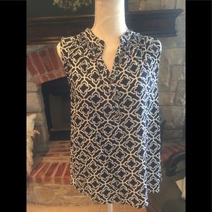 Classic blue and white sleeveless button up top.